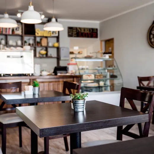 Inside The Happy Cup Cafe — warm, busy and cosy