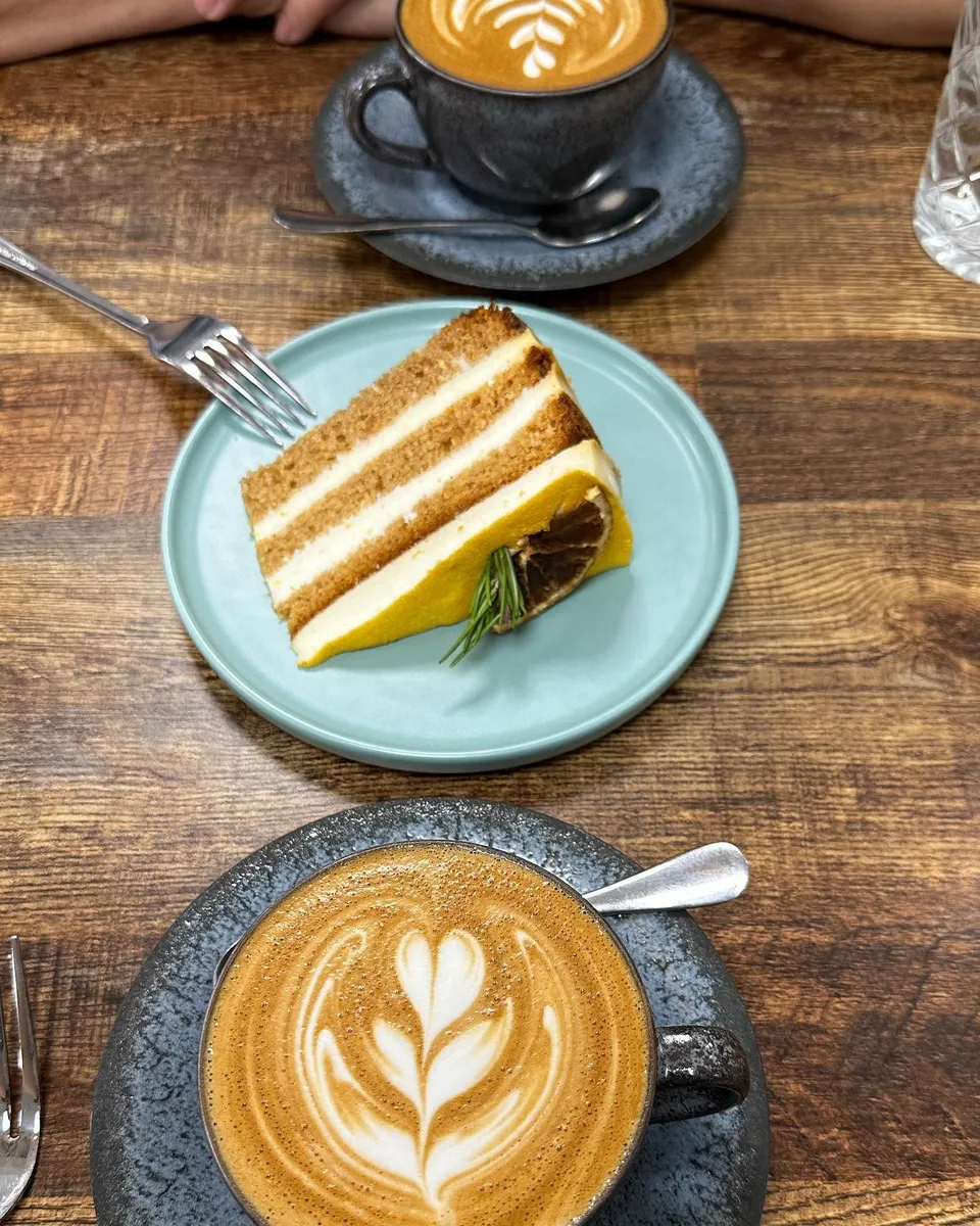 Coffee served with a slice of cake
