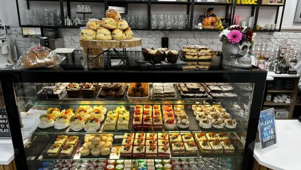 Homemade pastries on the glass stand at the counter
